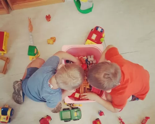 two kids playing with their toys